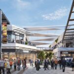Modern shopping center with retail stores, pedestrian areas and commercial facilities illustrating urban development in intermediate cities.